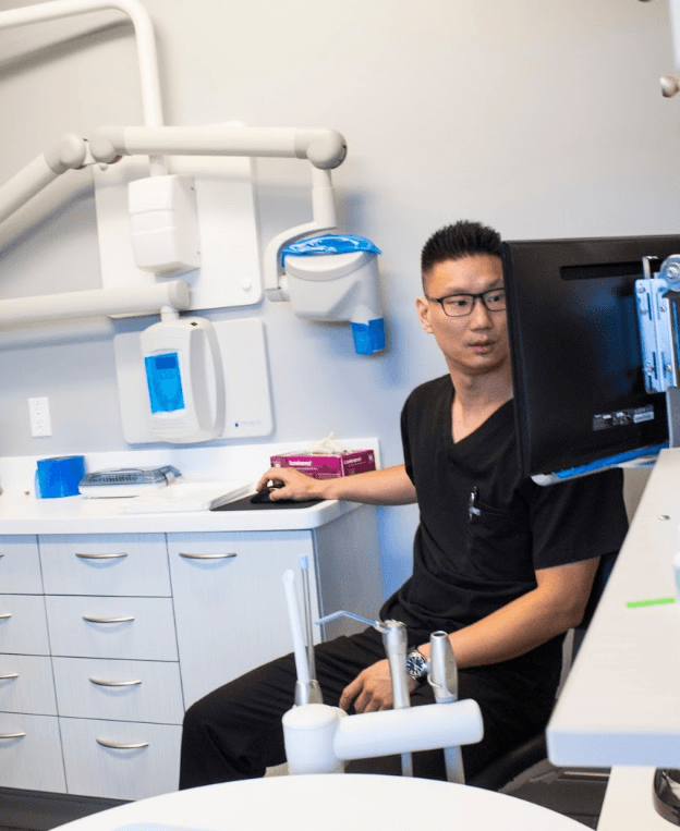 dr. chung looking at x-rays | dentist poway ca
